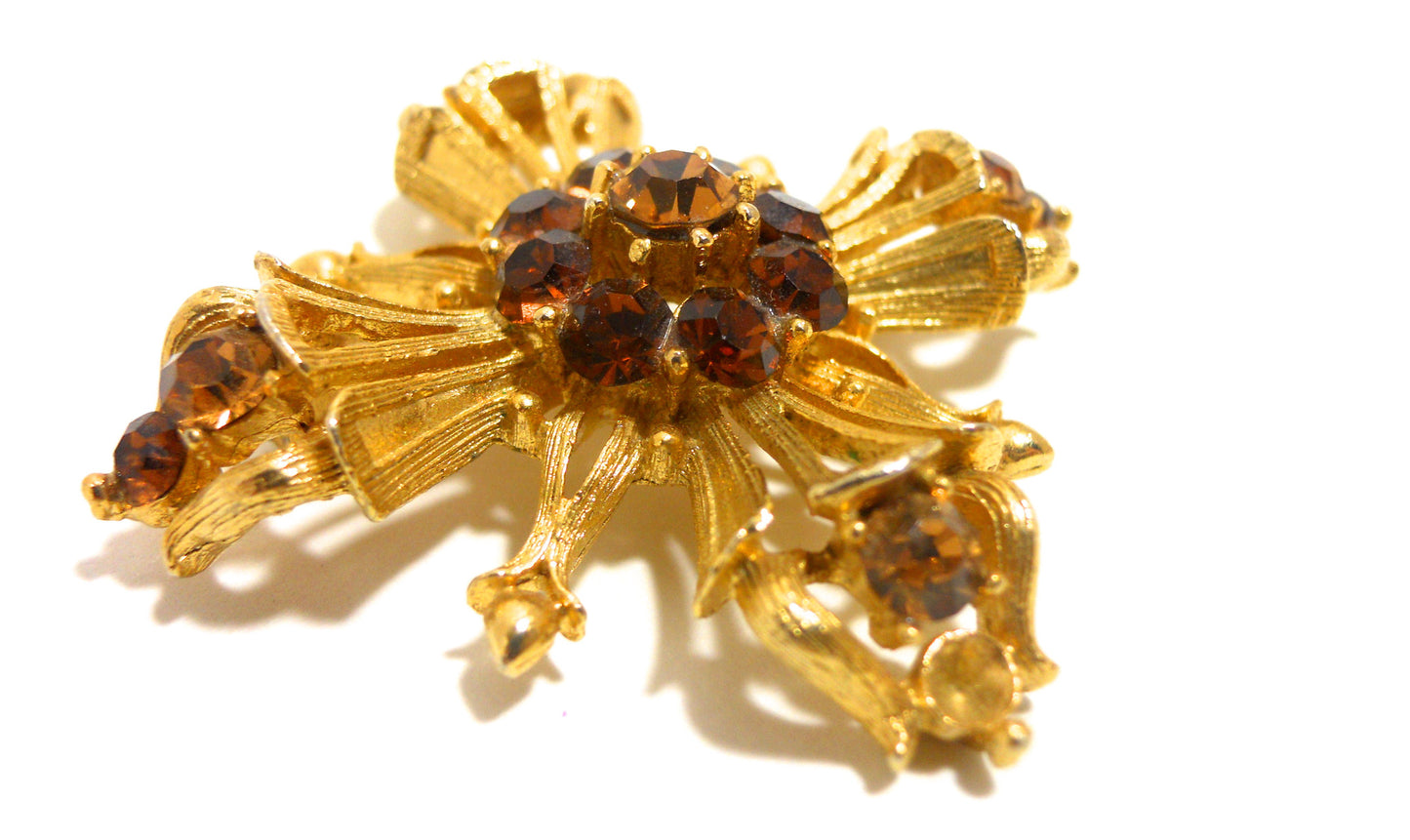 Topaz Hued Rhinestone Dotted Cross 1960s Pin