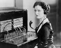 1920s telephone operator at switchboard
