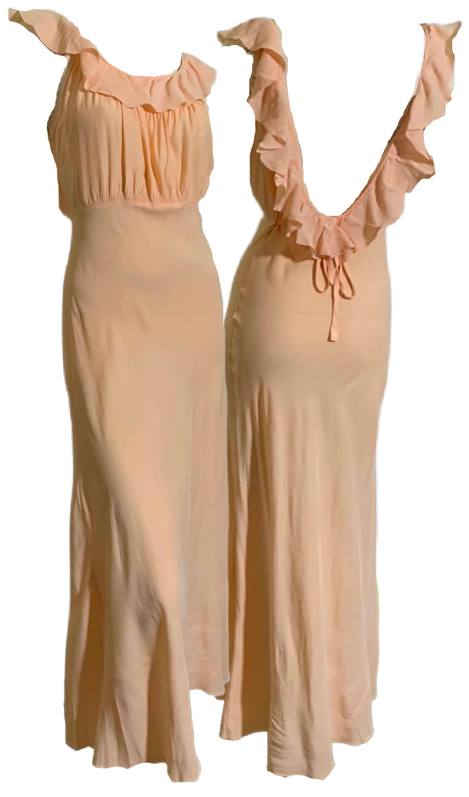 Two peach-colored vintage nightgowns with ruffled sleeves on a white background