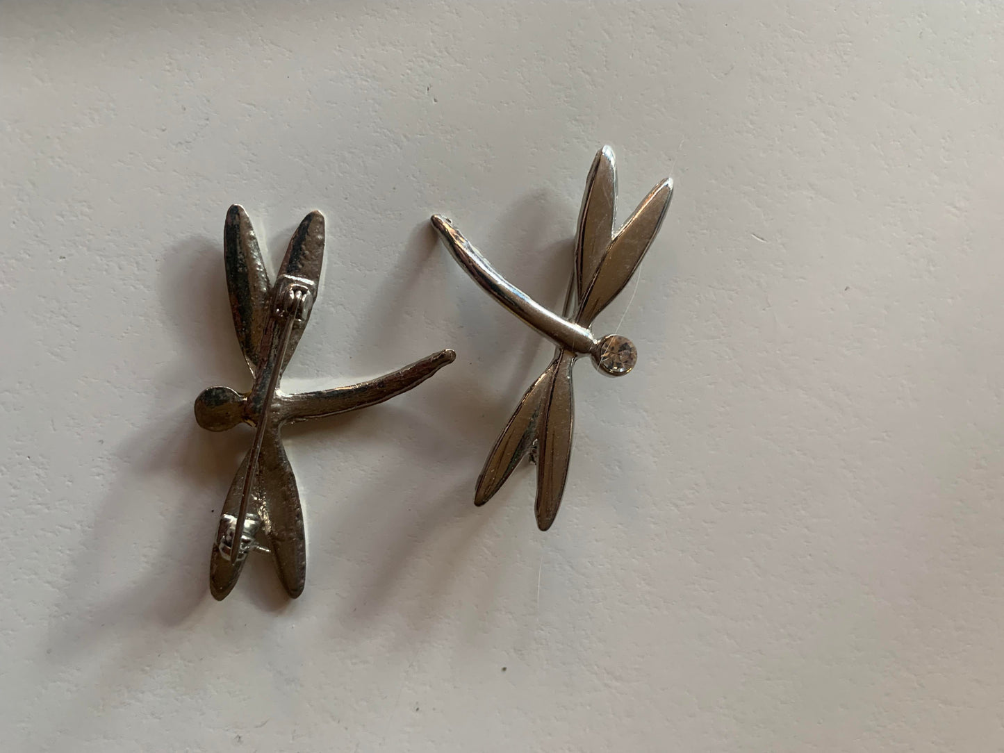 Pair of Silver Tone Metal and Rhinestone Dragonfly Brooches circa 1980s