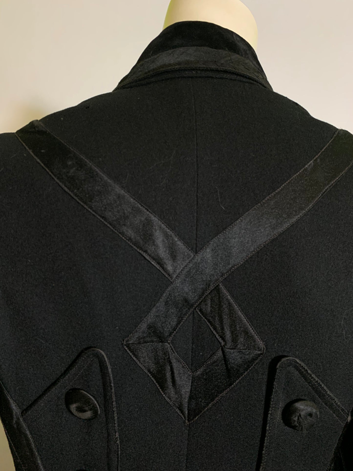 Beautiful Black Wool Double Breasted Coat with Silk Ribbon Design and Button Trimmed Back circa Early 1900s