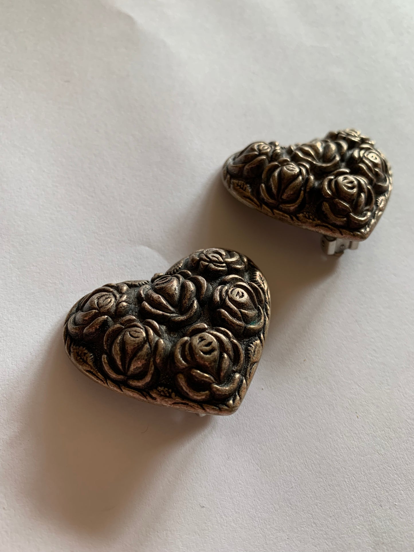 Baroque Textured Rose Design Heart Shaped Metal Clip Earrings circa 1980s