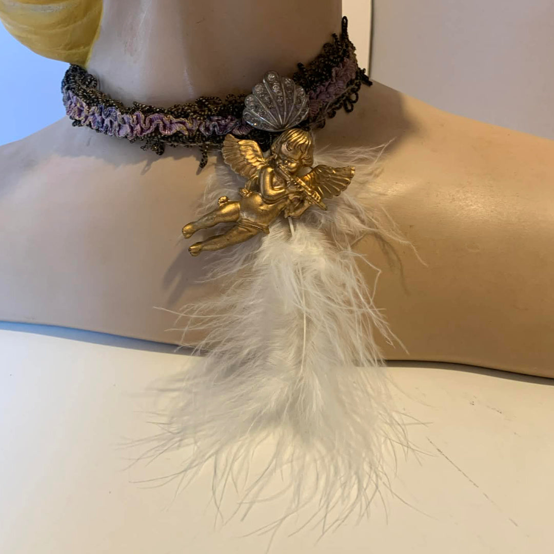 Magic Flute Reimagined Cherub Pendant Antique Ribbon Choker Necklace with Feather and Rhinestones