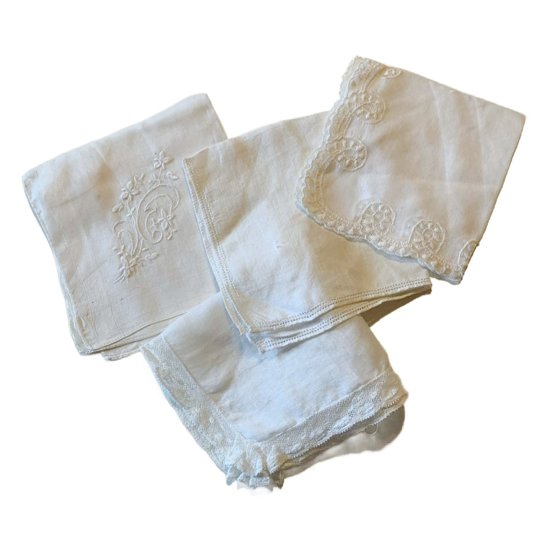 Set of white embroidered napkins on a white background
