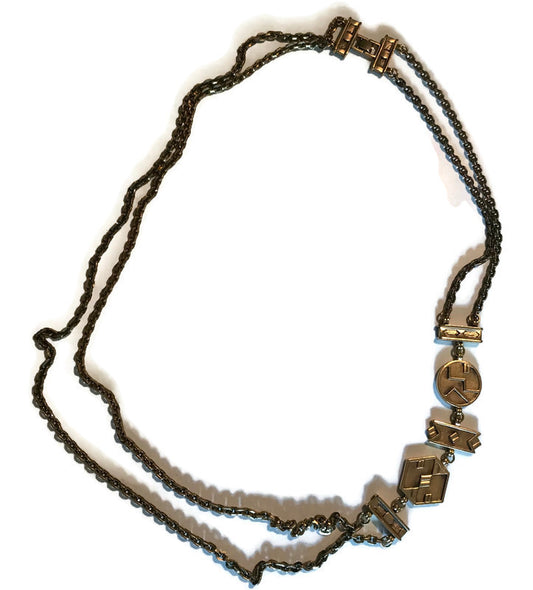 Striking Gold Tone Metal Double Chain Long Necklace with Abstract Side Links circa 1980s