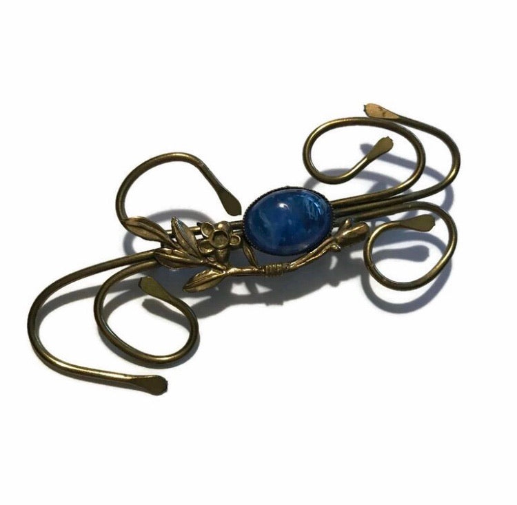 Medusa Inspired Gold Flower and Vine Brooch with Blue Art Glass Center circa 1910s
