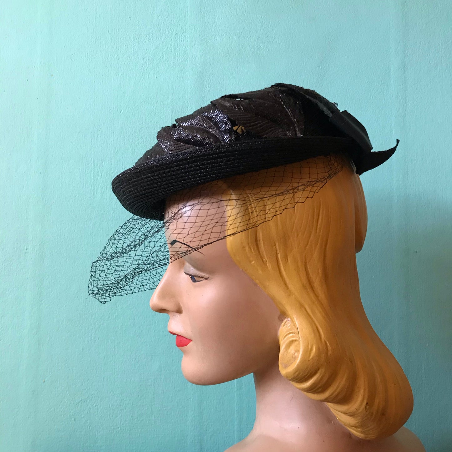 Black Narrow Brimmed Boater Style Hat with Flame Shaped Leaves on Open Top circa 1960s