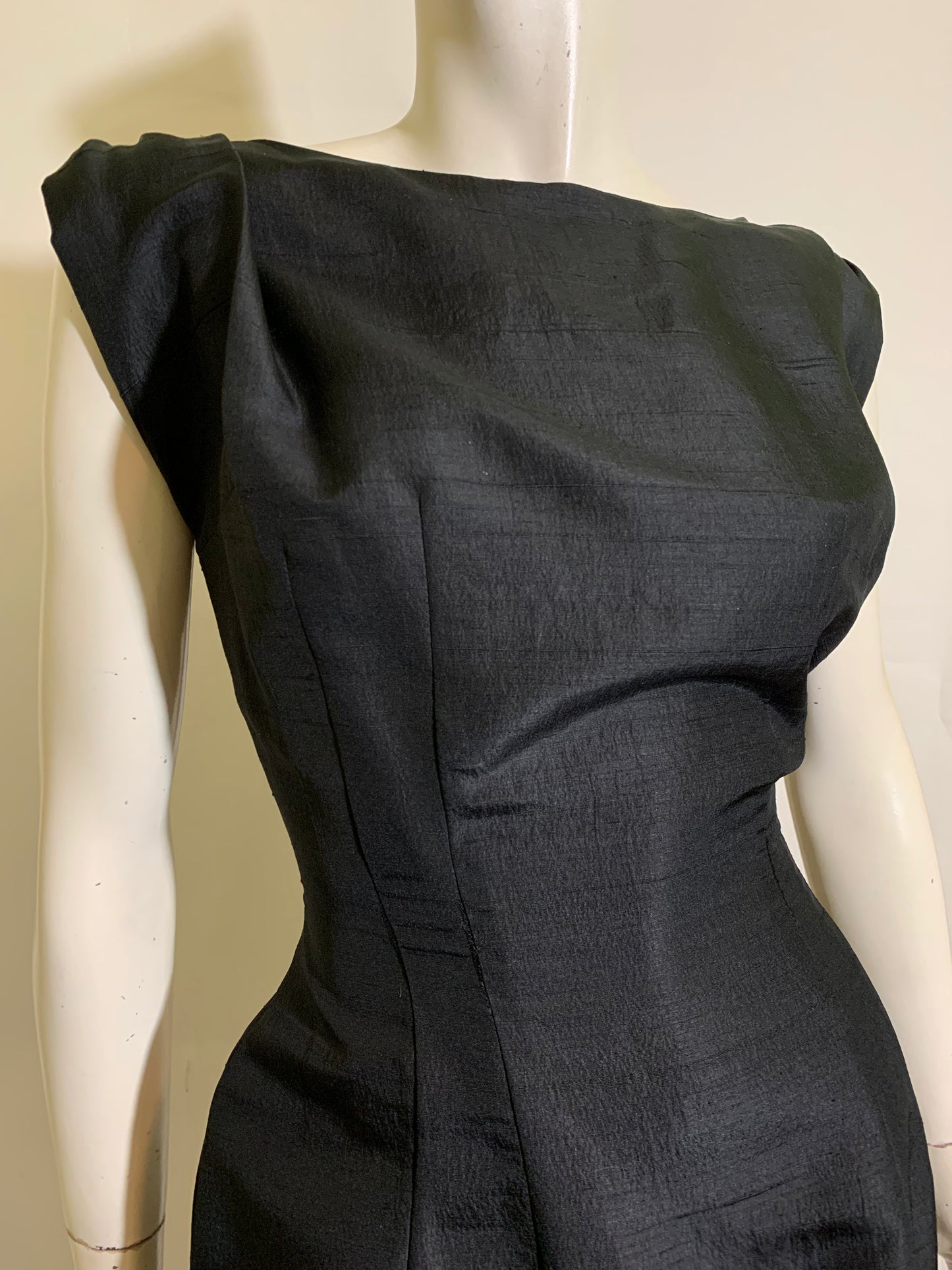 Show Stopping Figure Conscious Sleeveless Black Cocktail Dress with Daring Low Back Trimmed in Black and Red Roses circa 1950s